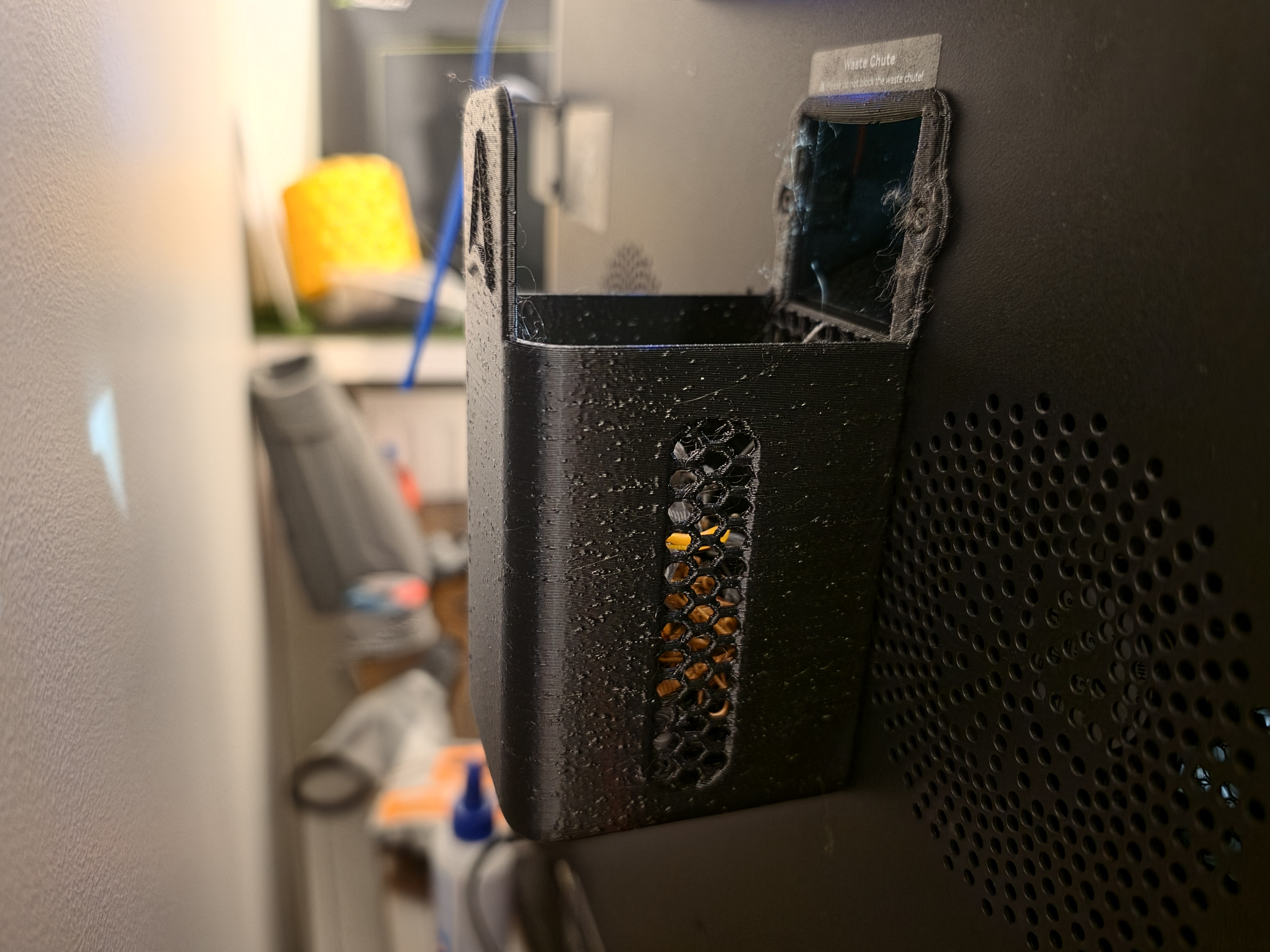 3D-printed purge waste reservoir mounted at the back of the Creality K2 Plus